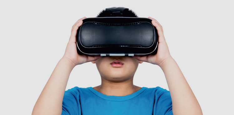 child wearing VR headset in blue shirt
